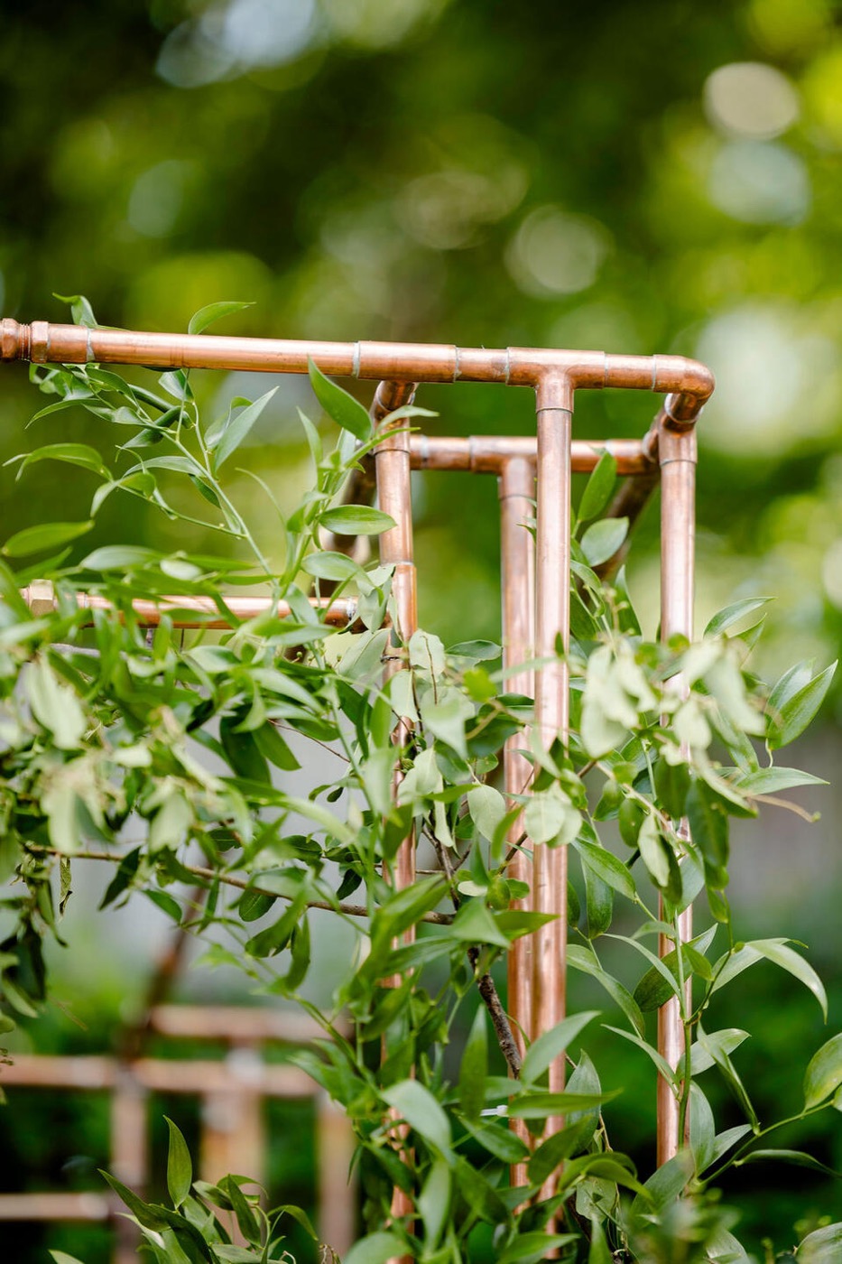 Detail of the copper pipe joinery with greenery